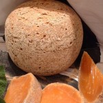 Mimolette Mimolette is a hard, aged cheese that looks like a cantelope. Somewhere between Cheddar and Gouda.