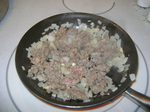 Well, that doesn't look too great. One small onion, chopped, two cloves of garlic, minced, and mix of sausage and beef.