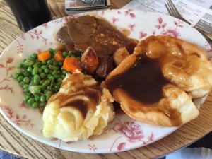 Sunday roast: Mash, veggies, beef, yorkshire pudding (like a chunk of bready goodness). Not enough gravy.